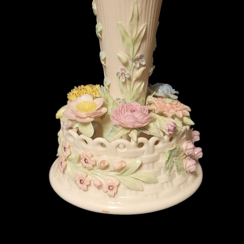277 - BELLEEK, A 20TH CENTURY IRISH PORCELAIN TRUMPET VASE
The central reeded trumpet with applied floral ... 