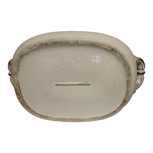 304 - A 19TH CENTURY POTTERY FOOTBATH
Twin handles with black and gilt decoration, impressed mark ‘LS234’.... 