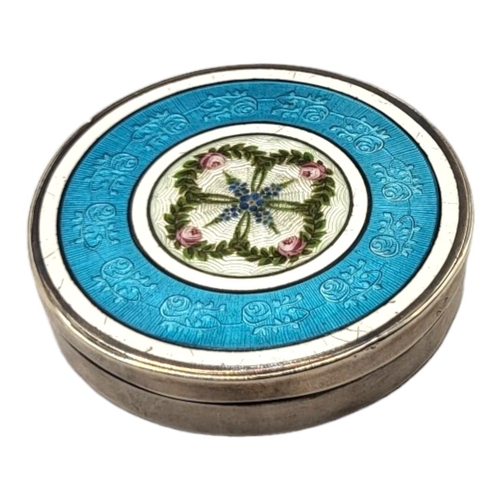 31 - AN EARLY 20TH CENTURY SILVER AND GUILLOCHÉ ENAMEL CIRCULAR PILL BOX
With central floral cartouche an... 