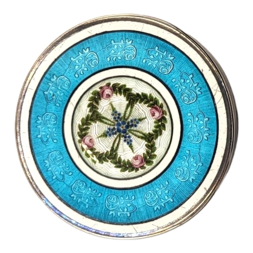 31 - AN EARLY 20TH CENTURY SILVER AND GUILLOCHÉ ENAMEL CIRCULAR PILL BOX
With central floral cartouche an... 