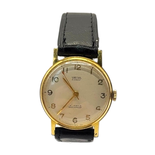 33 - SMITHS, EVEREST, A 1950’S YELLOW METAL CASED GENT’S SLIM WRISTWATCH
Having a gold tone dial, Arabic ... 