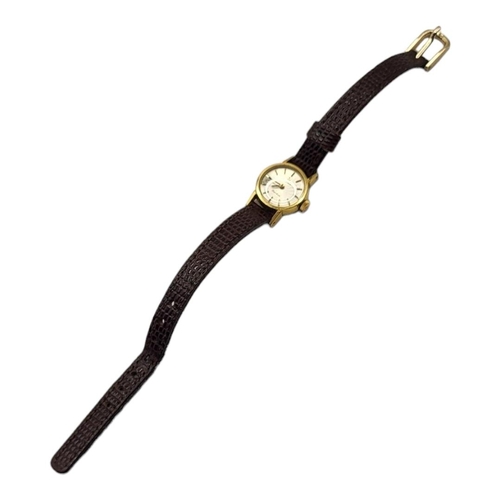 35A - OMEGA, A VINTAGE GOLD PLATED LADIES’ WRISTWATCH
Having a silver tone dial and burgundy leather strap... 