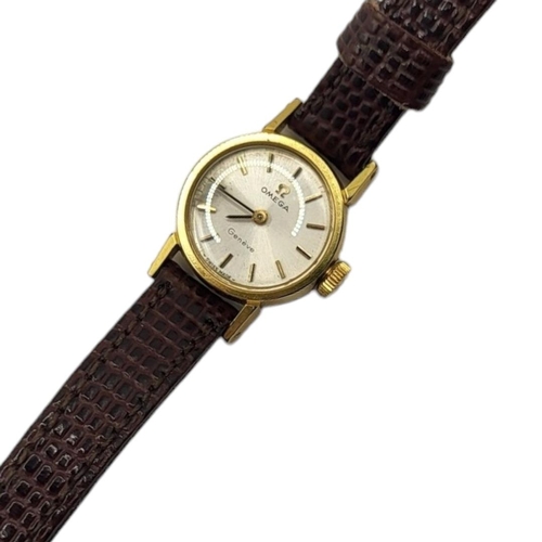 35A - OMEGA, A VINTAGE GOLD PLATED LADIES’ WRISTWATCH
Having a silver tone dial and burgundy leather strap... 