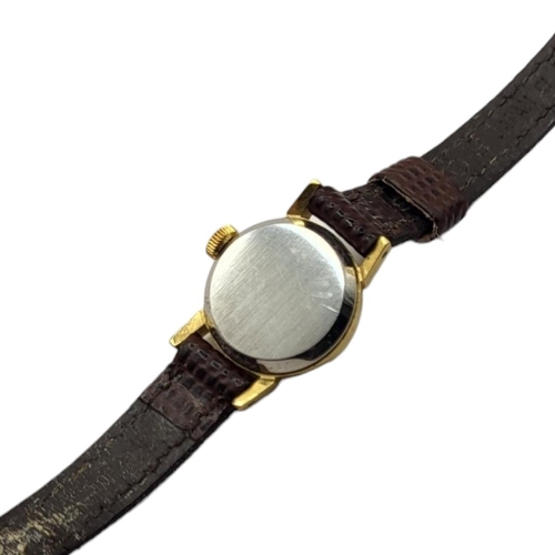 35A - OMEGA, A VINTAGE GOLD PLATED LADIES’ WRISTWATCH
Having a silver tone dial and burgundy leather strap... 