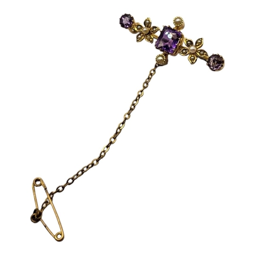 40 - A LATE 19TH/EARLY 20TH CENTURY 15CT GOLD, AMETHYST AND MICRO SEED PEARL BAR BROOCH
Set with an openw... 