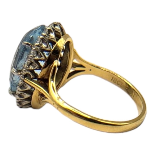 42 - AN EARLY 20TH CENTURY ATTRACTIVE 18CT GOLD AND AQUAMARINE LADIES’ DRESS RING
The oval fancy brillian... 