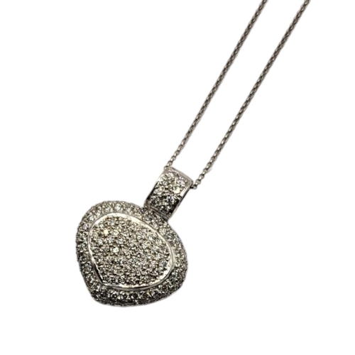 47 - AN 18CT WHITE GOLD AND DIAMOND HEART PENDANT NECKLACE
Having pavé set diamonds in a hollow pierced d... 