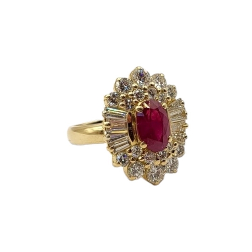 50 - AN 18CT GOLD, RUBY AND DIAMOND CLUSTER RING
The central oval cut ruby,edged with baguette and round ... 