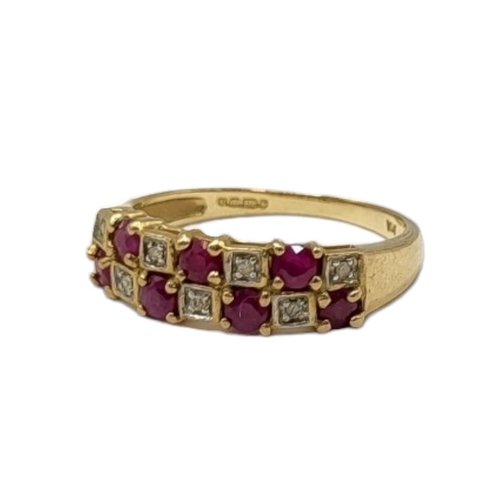 51 - A VINTAGE 9CT GOLD, RUBY AND DIAMOND HALF ETERNITY RIMG
Two rows of round cut rubies interspersed wi... 