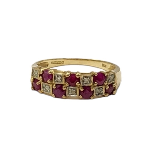 51 - A VINTAGE 9CT GOLD, RUBY AND DIAMOND HALF ETERNITY RIMG
Two rows of round cut rubies interspersed wi... 