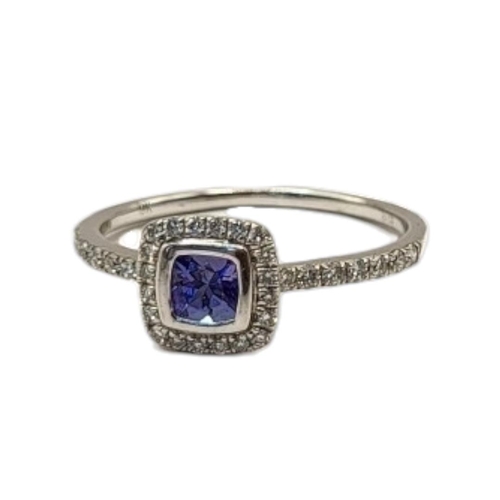 52 - A 9CT WHITE GOLD, SAPPHIRE AND DIAMOND RING
The central square cut stone,edged with diamonds with di... 