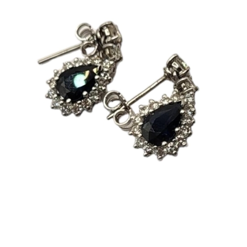 58 - A PAIR OF 18CT WHITE GOLD, SAPPHIRE AND DIAMOND EARRINGS
Set with a pear cut sapphire edged with dia... 