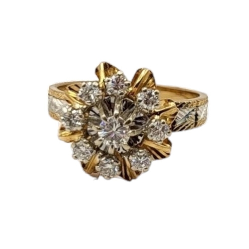 66 - A FRENCH 18CT BICOLOUR GOLD AND DIAMOND CLUSTER RING
The arrangement of round cut diamonds with whit... 