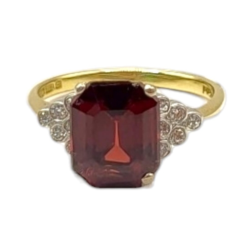 68 - AN 18CT GOLD, GARNET AND DIAMOND RING
The rectangular faceted cut stone with diamonds to shoulders.
... 