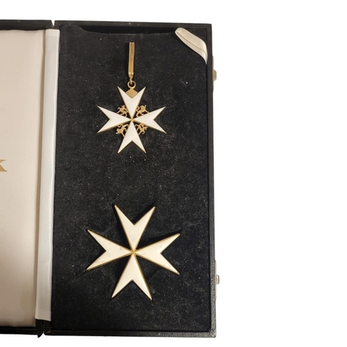 69 - ORDER OF ST. JOHNS, A SILVER GILT AND ENAMEL KNIGHTS STAR AND BREAST STAR
Mounted with a pair of lio... 