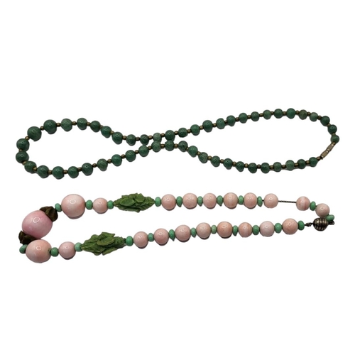 8 - TWO EARLY 20TH CENTURY CHINESE JADE NECKLACES
Having an arrangement of spherical pink jade beads int... 