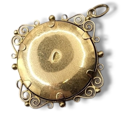 80 - A LATE 19TH/EARLY 20TH CENTURY 15CT GOLD PENDANT LOCKET
The circular form with wire work mounted and... 