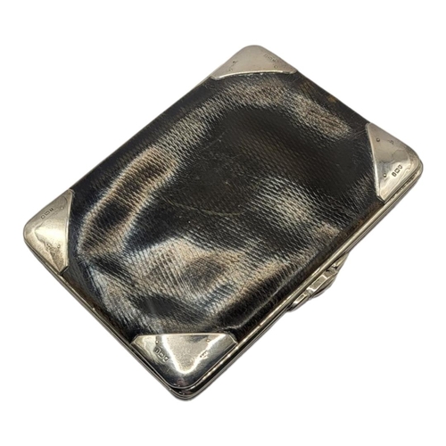 97 - AN EDWARDIAN SILVER AND LEATHER GENTLEMAN'S WALLET
Four silver corners hallmarked London, 1904, with... 