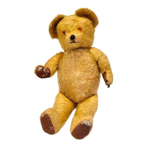 243 - A VINTAGE GOLD MOHAIR TEDDY BEAR
Amber glass eyes and stitched black nose.
(approx 60cm)

Condition:... 