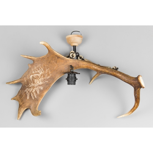 103 - A 20TH CENTURY ANTLER CHANDELIER.
(w 67cm)