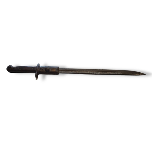 389 - TWO EARLY 20TH CENTURY BAYONETS
A 1907 Wilkinson Bayonet with carved wooden handle and AN ebonised b... 