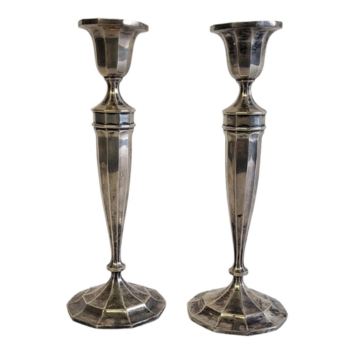 27A - A PAIR OF ART DECO STYLE STERLING SILVER CANDLESTICKS
Decagonal shaped bobeche and tapering column, ... 