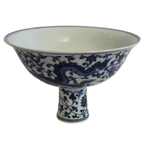 356 - A CHINESE BLUE AND WHITE PORCELAIN 'DRAGON' STEM CUP
Decorated with five claw dragons and six Chines... 