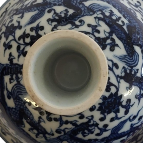 356 - A CHINESE BLUE AND WHITE PORCELAIN 'DRAGON' STEM CUP
Decorated with five claw dragons and six Chines... 