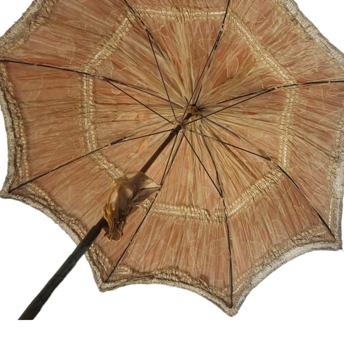 151A - A LATE 19TH/EARLY 20TH CENTURY SILK PARASOL
Hand painted decoration with leaves on peach ground with... 