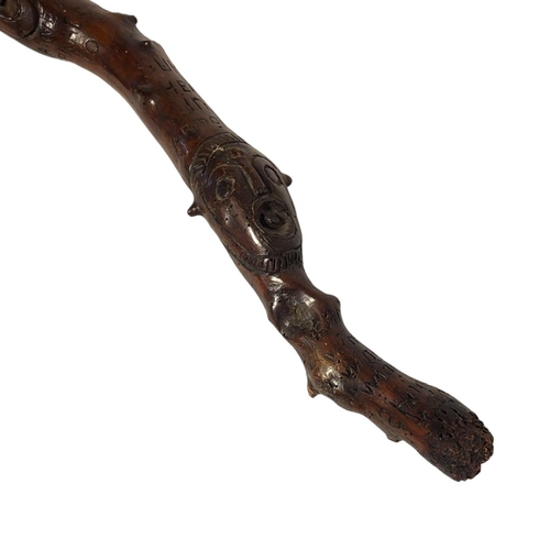 154A - AN UNUSUAL MID 19TH CENTURY CARVED FIGURAL WALKING CANE
Comical mask handle and animal masks to body... 