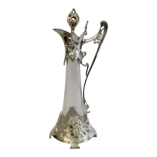 29A - A STYLISH ART NOUVEAU DESIGN WHITE METAL AND CLEAR GLASS CLARET CLARET JUG.
(w 17cm x d 17cm x h 43c... 