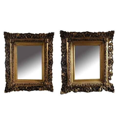 586 - A PAIR OF 19TH CENTURY STYLE GILT FRAMED MIRRORS
With acanthus carved corners centred with bevelled ... 