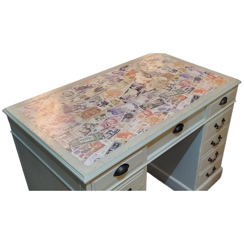 579 - AN EDWARDIAN PAINTED PINE KNEEHOLE DESK
Three drawers over two banks of four drawers, set with print... 