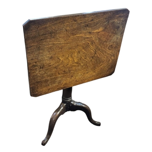 599 - AN 18TH CENTURY SOLID MAHOGANY TILT TOP SUPPER TABLE
The rectangular top on turned cannon barrel col... 