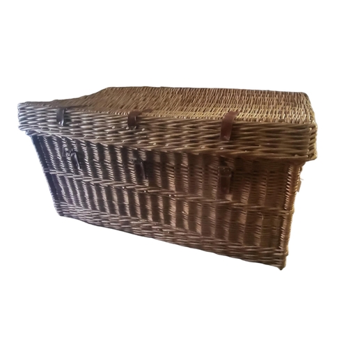 600 - BREXTON FOR ASPREY OF LONDON, A LARGE WICKER PICNIC BASKET WITH LEATHER HANDLES 
With fitted interio... 