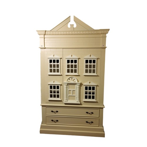 582 - A CHILD'S LINEN PRESS IN THE FORM OF A DOLL'S HOUSE
With architectural pediment above two doors fitt... 