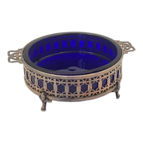 108 - MAPPIN & WEBB, AN EDWARDIAN SILVER AND BLUE GLASS BUTTER DISH 
Having twin handles, pierced decorati... 