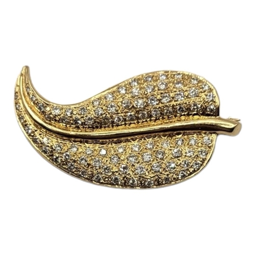 12A - A 14CT GOLD AND DIAMOND LEAF FORM BROOCH 
Having an arrangement of graduated round cut stones in a P... 