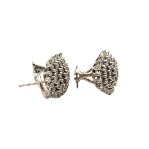 13A - A PAIR OF 9CT WHITE GOLD DIAMOND CLUSTER EARRINGS
Having an arrangement of diamonds forming an hexag... 