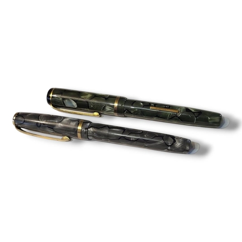 15 - BURNHAM, TWO EARLY 20TH CENTURY FOUNTAIN PENS
Green marbled number 50 and a grey marbled case number... 