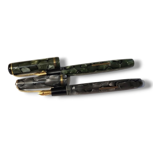 15 - BURNHAM, TWO EARLY 20TH CENTURY FOUNTAIN PENS
Green marbled number 50 and a grey marbled case number... 