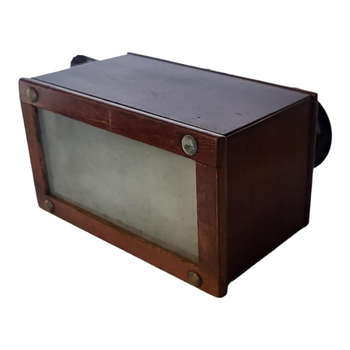 157 - AN EARLY 20TH CENTURY MAHOGANY CASED STEREOSCOPE
With glass slides, one slide damaged corners.