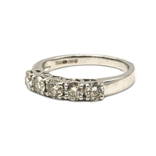 15A - AN 18CT WHITE GOLD FIVE STONE DIAMOND RING
The single row of round cut diamonds in a plain design.
(... 