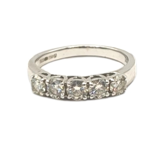 15A - AN 18CT WHITE GOLD FIVE STONE DIAMOND RING
The single row of round cut diamonds in a plain design.
(... 