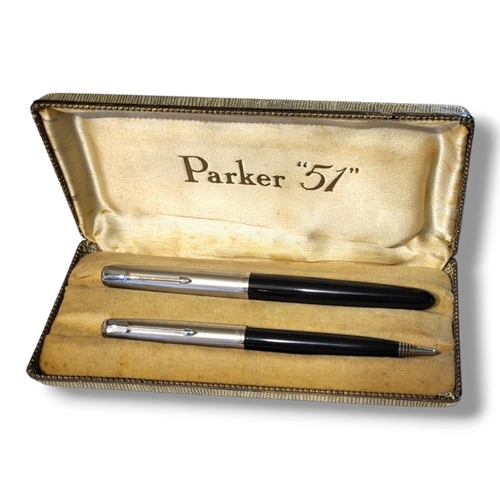 16 - PARKER 51, A VINTAGE FOUNTAIN PEN AND PROPELLING PENCIL SET
Steel and black resin set in fitted velv... 