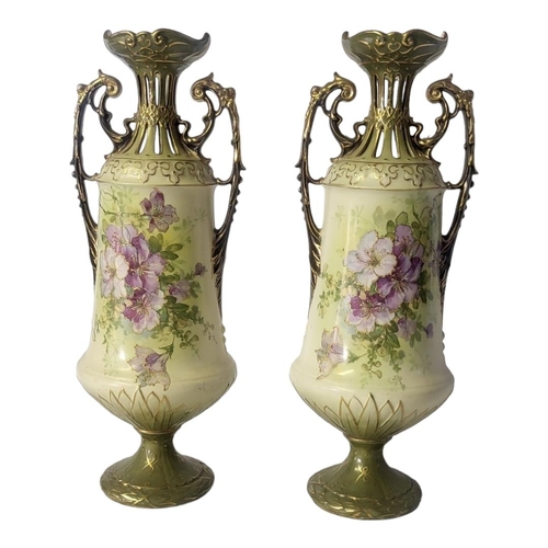 162 - A PAIR OF AUSTRIA BOHEMIAN OF TURN ELABORATE DESIGN PORCELAIN TWIN HANDLED VASES, CIRCA 1880
Both en... 