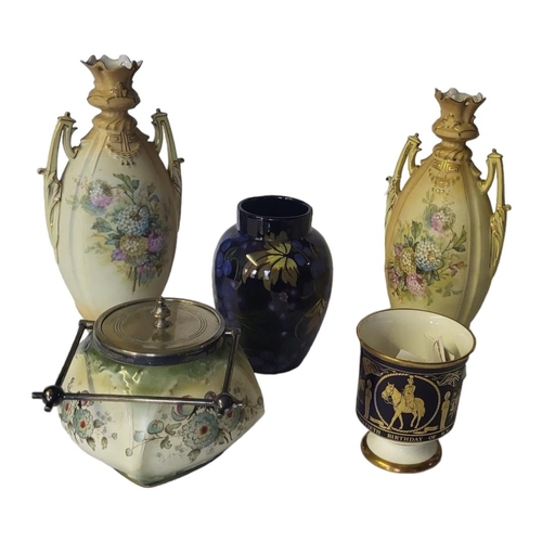 165 - A PAIR OF ART NOUVEAU BOHEMIAN PORCELAIN TWIN HANDLED FLORA DECORATED VASES
With arch shaped scrolli... 