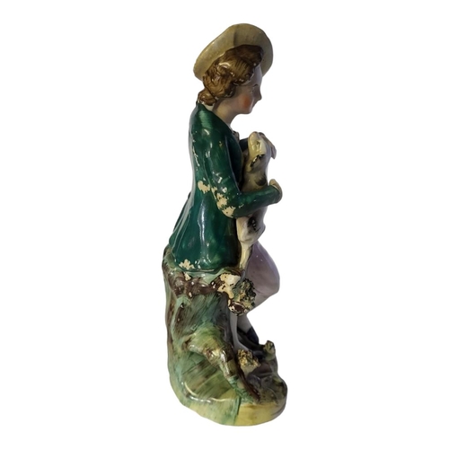 168 - AN EARLY VICTORIAN STAFFORDSHIRE PORCELANEOUS GARDENER AND HIS DOG, CIRCA 1840
Modelled in standing ... 