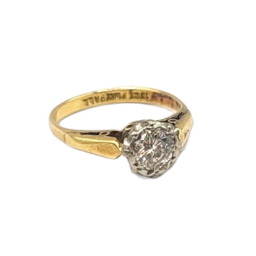 18A - AN EARLY 20TH CENTURY 18CT GOLD AND DIAMOND SOLITAIRE RING
The single round cut diamond in a platinu... 