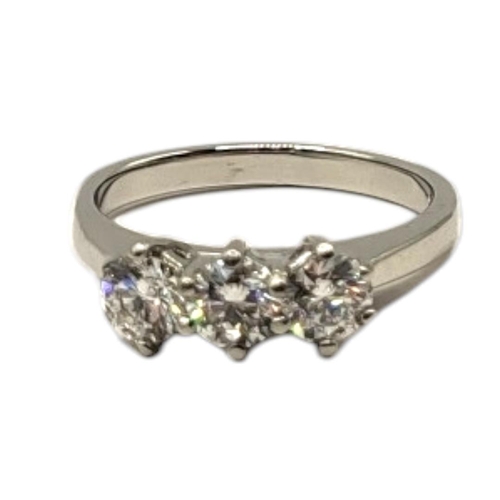 1A - A PLATINUM AND DIAMOND THREE STONE RING
The round cut diamonds in plain platinum mount,together with... 